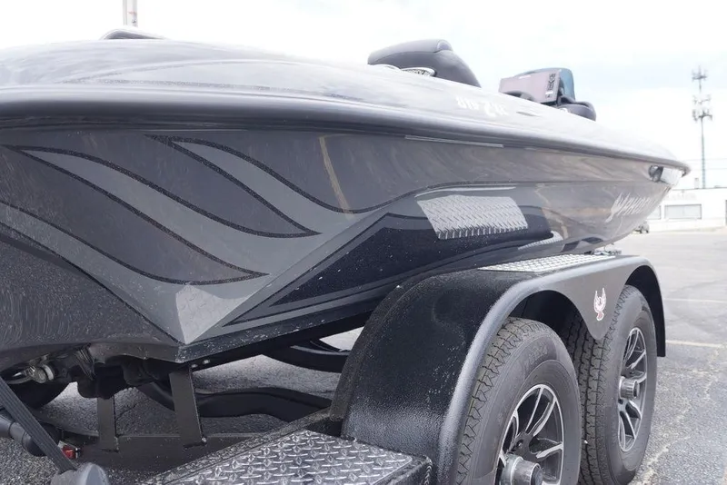Slide: The Image of 2026 Phoenix 819 ZXL boat on trailer, sleek design with custom graphics. - 8