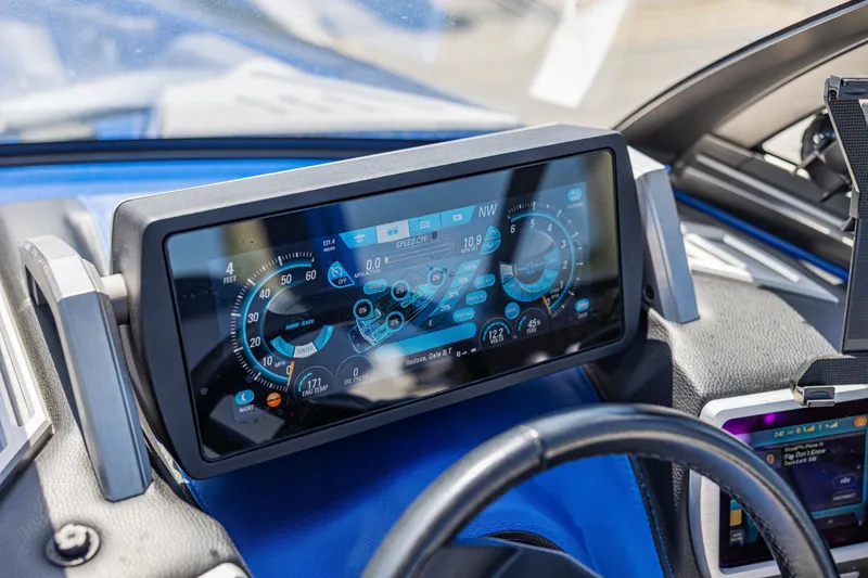 Slide: The Image of Dashboard of a 2017 Malibu M235 boat with digital display and controls. - 34