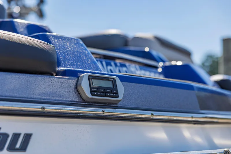 Slide: The Image of Close-up of a 2017 Malibu M235 boat dashboard with control panel. - 40