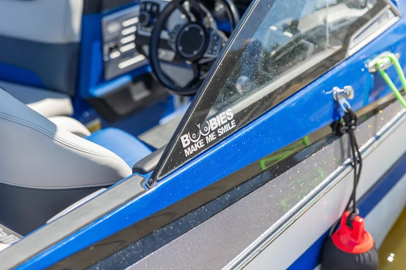 Slide: The Image of 2017 Malibu M235 boat interior with humorous decal on windshield. - 42
