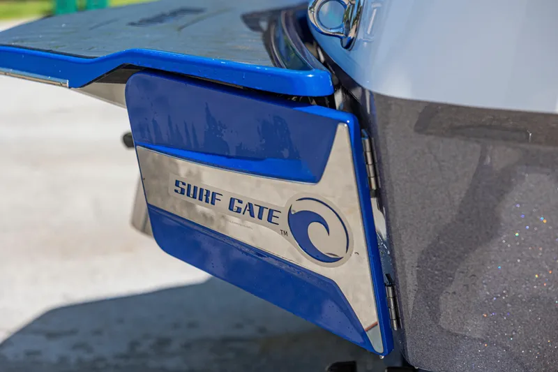 Slide: The Image of 2017 Malibu M235 Surf Gate feature on boat's rear, enhancing wake surfing experience. - 44