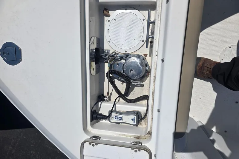 Slide: The Image of 2016 Sailfish 275 DC boat compartment with winch and control panel. - 9