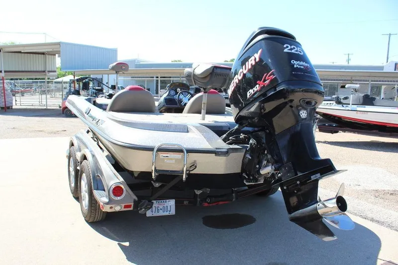 Slide: The Image of 2011 Ranger Z120 Comanche boat with Mercury Pro XS engine, parked on a trailer. - 10