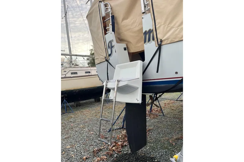 Slide: The Image of 1999 Hake Yachts Seaward Eagle 32 sailboat with ladder and covered stern, on dry dock. - 10