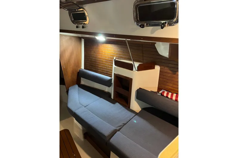Slide: The Image of Interior of 1999 Seaward Eagle 32 yacht with cozy seating and wooden accents. - 17