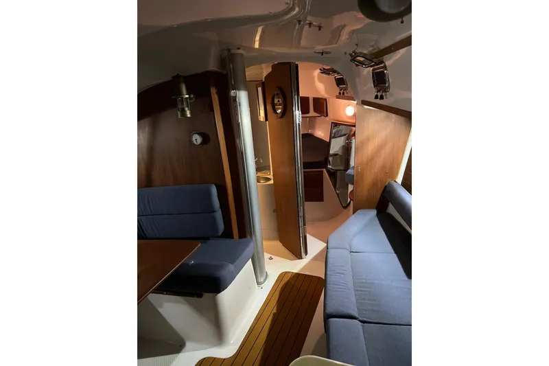 Slide: The Image of Interior of 1999 Seaward Eagle 32 yacht with cozy seating and wooden accents. - 22
