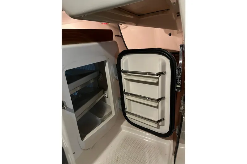 Slide: The Image of Interior view of a 1999 Seaward Eagle 32 yacht refrigerator compartment. - 27