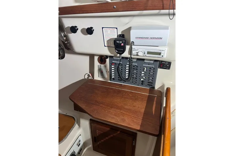 Slide: The Image of Control panel of 1999 Seaward Eagle 32 yacht with radio and switches. - 28