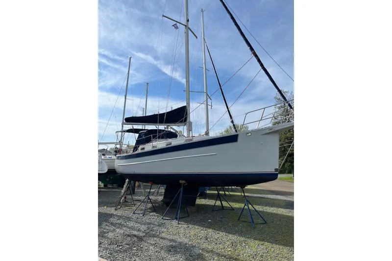Slide: The Image of 1999 Seaward Eagle 32 sailboat by Hake Yachts Inc on stands, under a clear sky. - 3