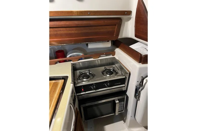 Slide: The Image of Compact kitchen area in a 1999 Seaward Eagle 32 yacht by Hake Yachts Inc. - 30