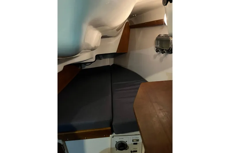 Slide: The Image of Interior cabin of 1999 Hake Yachts Seaward Eagle 32, featuring cozy sleeping area. - 35