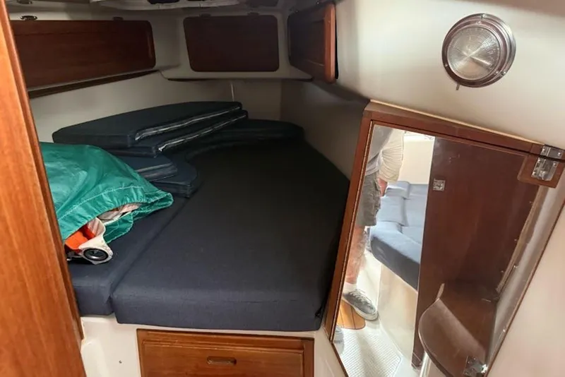 Slide: The Image of Cozy cabin interior of 1999 Seaward Eagle 32 yacht with cushions and storage. - 36