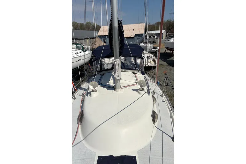 Slide: The Image of 1999 Hake Yachts Seaward Eagle 32 sailboat docked, showcasing deck and rigging. - 4
