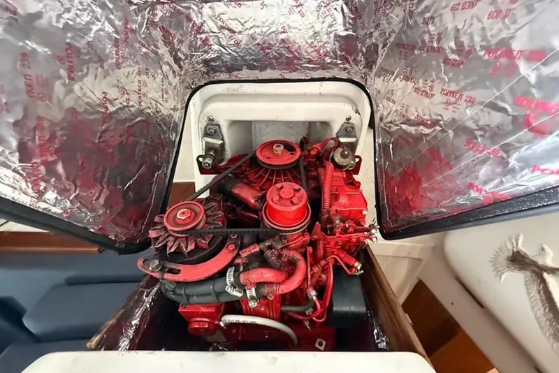 Slide: The Image of Engine compartment of a 1999 Hake Yachts Seaward Eagle 32, featuring a red engine. - 40