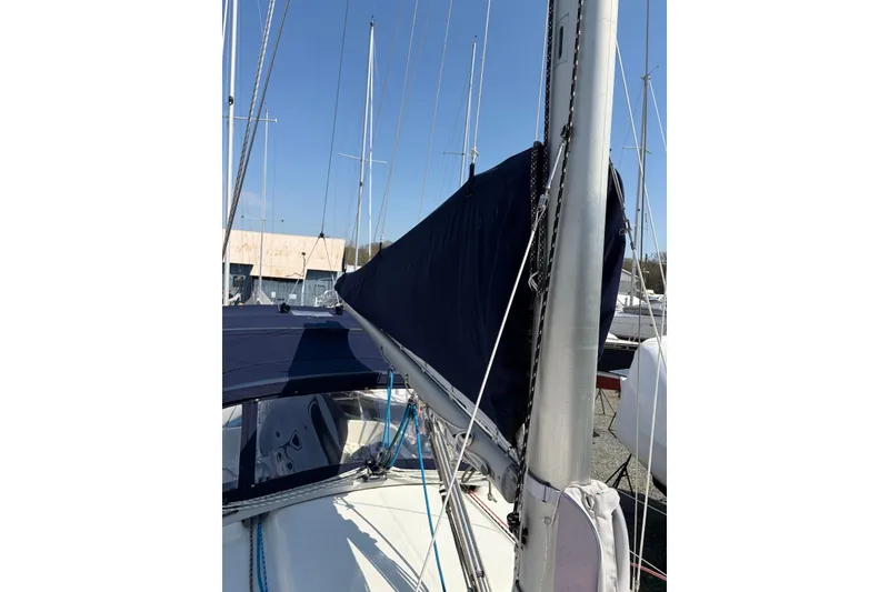Slide: The Image of 1999 Hake Yachts Seaward Eagle 32 sailboat with covered mainsail, docked in a marina. - 8