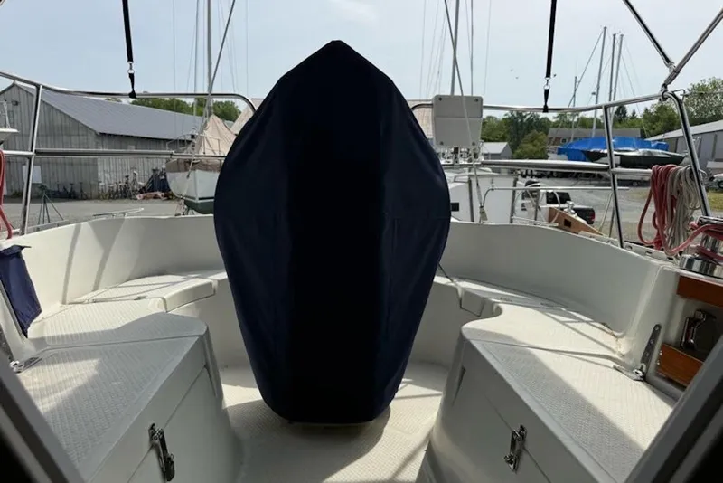 Slide: The Image of 1999 Hake Yachts Seaward Eagle 32 cockpit with covered helm, docked at marina. - 9