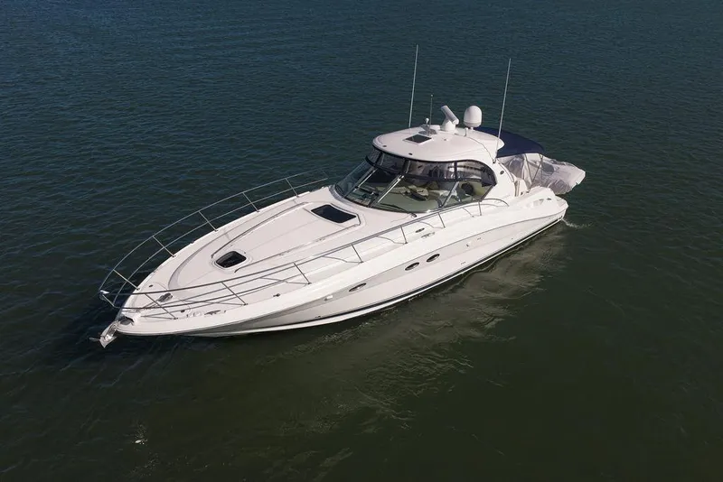 Slide: The Image of 2005 Sea Ray 420 Sundancer yacht cruising on open water. - 1
