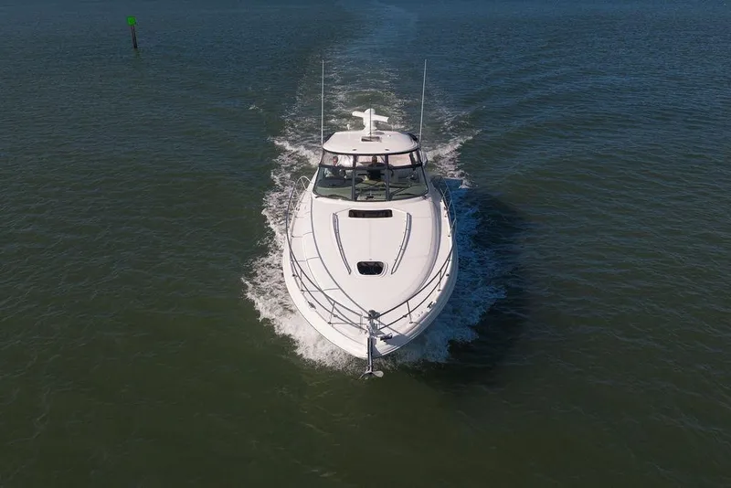Slide: The Image of 2005 Sea Ray 420 Sundancer cruising on open water, aerial view. - 10