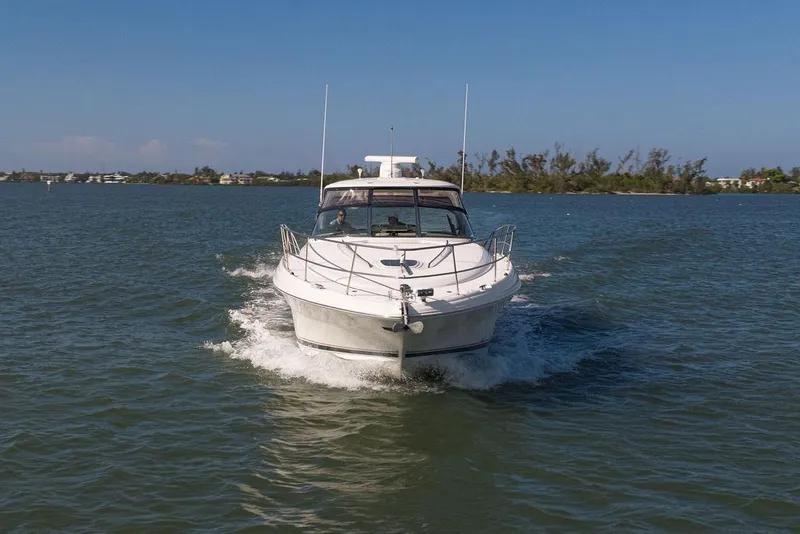 Slide: The Image of 2005 Sea Ray 420 Sundancer cruising on a sunny day in open waters. - 13