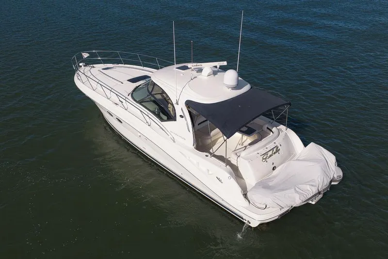Slide: The Image of 2005 Sea Ray 420 Sundancer yacht cruising on calm waters. - 15