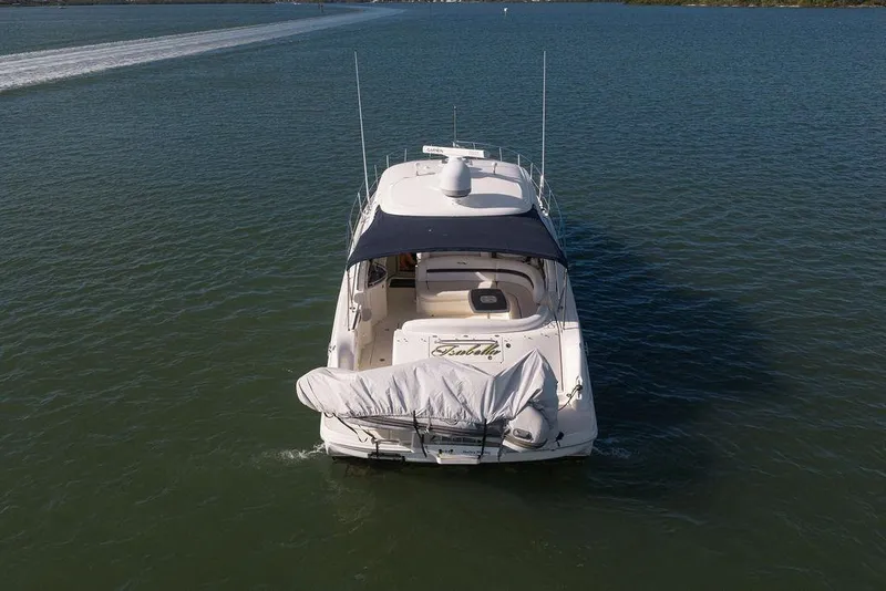 Slide: The Image of 2005 Sea Ray 420 Sundancer yacht cruising on calm waters, rear view. - 16