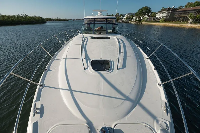 Slide: The Image of 2005 Sea Ray 420 Sundancer yacht cruising on a scenic waterway. - 20