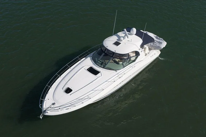 Slide: The Image of 2005 Sea Ray 420 Sundancer yacht cruising on open water. - 3