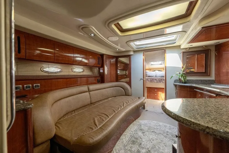 Slide: The Image of Luxurious interior of a 2005 Sea Ray 420 Sundancer yacht with elegant wood finishes. - 30