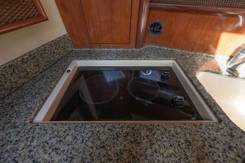 Slide: The Image of Granite countertop with built-in stove on 2005 Sea Ray 420 Sundancer yacht. - 34