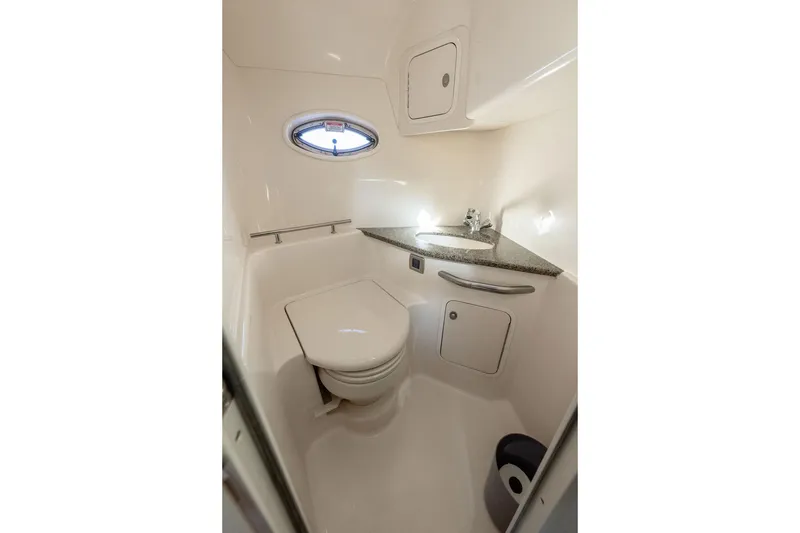 Slide: The Image of 2005 Sea Ray 420 Sundancer bathroom with compact design and modern fixtures. - 36