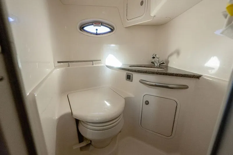 Slide: The Image of Compact bathroom in 2005 Sea Ray 420 Sundancer yacht with sink and toilet. - 37
