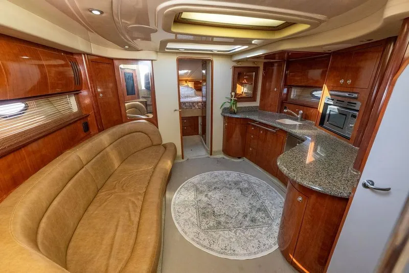 Slide: The Image of Luxurious interior of 2005 Sea Ray 420 Sundancer yacht with elegant wood finishes and modern amenities. - 40