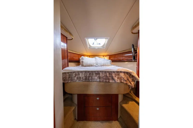 Slide: The Image of Luxurious cabin interior of 2005 Sea Ray 420 Sundancer yacht with cozy bedding. - 42