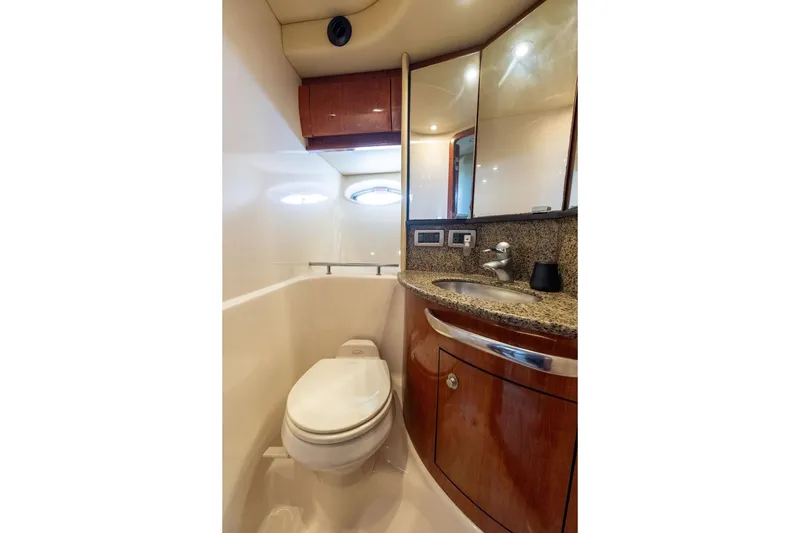 Slide: The Image of Luxurious bathroom in 2005 Sea Ray 420 Sundancer yacht with modern fixtures and wood cabinetry. - 43