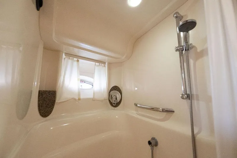 Slide: The Image of Interior shower of 2005 Sea Ray 420 Sundancer yacht, featuring sleek design and modern fixtures. - 46