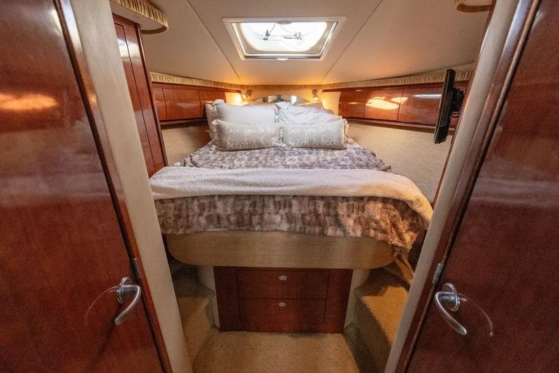 Slide: The Image of Luxurious cabin interior of 2005 Sea Ray 420 Sundancer yacht with cozy bedding. - 50