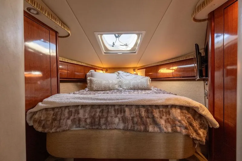 Slide: The Image of Luxurious cabin interior of 2005 Sea Ray 420 Sundancer yacht with cozy bedding. - 51