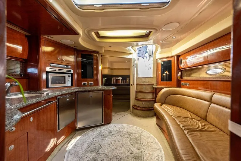 Slide: The Image of Luxurious interior of a 2005 Sea Ray 420 Sundancer yacht with elegant wood finishes. - 54