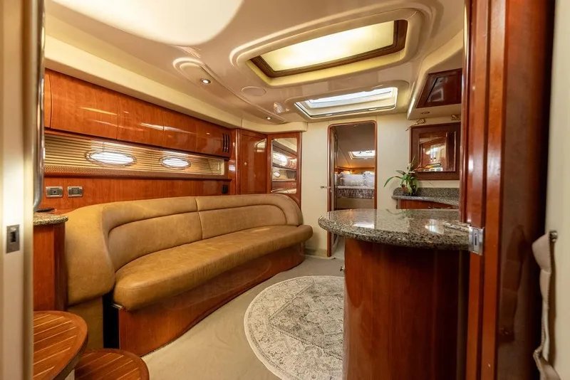 Slide: The Image of Luxurious interior of 2005 Sea Ray 420 Sundancer yacht with elegant wood finishes. - 56