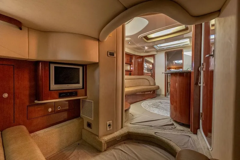 Slide: The Image of Luxurious interior of 2005 Sea Ray 420 Sundancer yacht with wood finishes and cozy seating. - 57