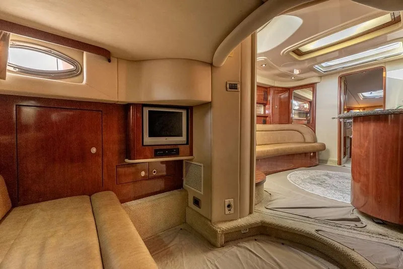 Slide: The Image of Luxurious interior of 2005 Sea Ray 420 Sundancer yacht with wood finishes and cozy seating. - 58