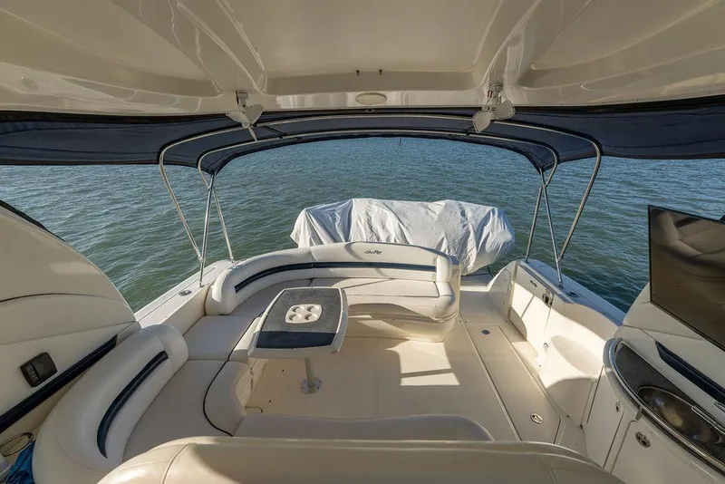 Slide: The Image of Luxurious 2005 Sea Ray 420 Sundancer yacht interior with elegant seating and scenic water view. - 61