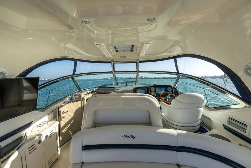 Slide: The Image of Interior view of 2005 Sea Ray 420 Sundancer yacht with helm and seating. - 63