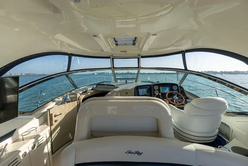 Slide: The Image of Interior view of 2005 Sea Ray 420 Sundancer yacht cockpit with panoramic windows. - 64