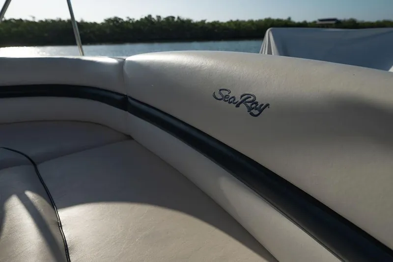 Slide: The Image of 2005 Sea Ray 420 Sundancer boat interior with logo, featuring elegant seating. - 72