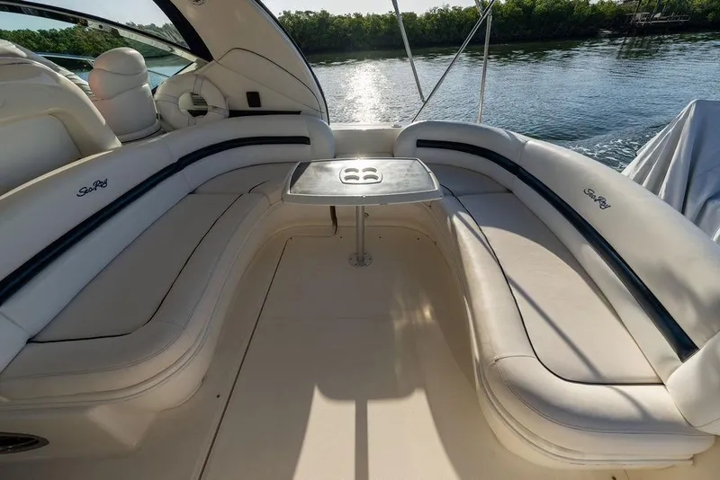 Slide: The Image of Luxurious seating area on a 2005 Sea Ray 420 Sundancer yacht, overlooking serene waters. - 73