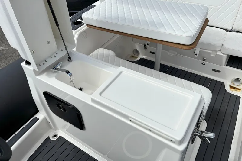 Slide: The Image of 2026 Zodiac Medline 7.5 GT boat interior with seating, table, and storage compartment. - 18