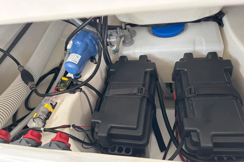 Slide: The Image of 2026 Zodiac Medline 7.5 GT boat interior showing battery compartment and wiring. - 19