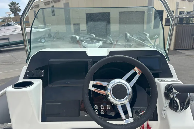 Slide: The Image of Steering console of 2026 Zodiac Medline 7.5 GT boat with modern controls. - 9