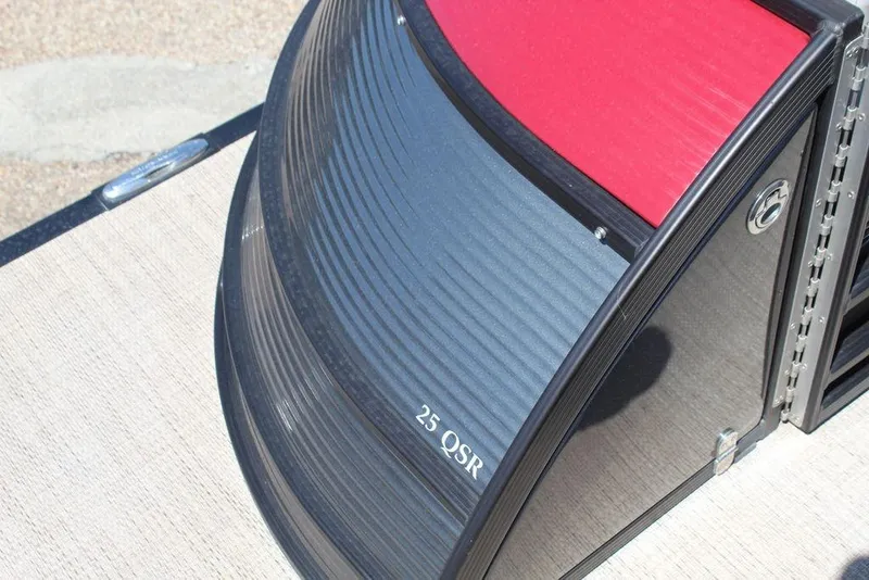Slide: The Image of 2019 Bennington 25 QSR boat detail with sleek design and red accents. - 6